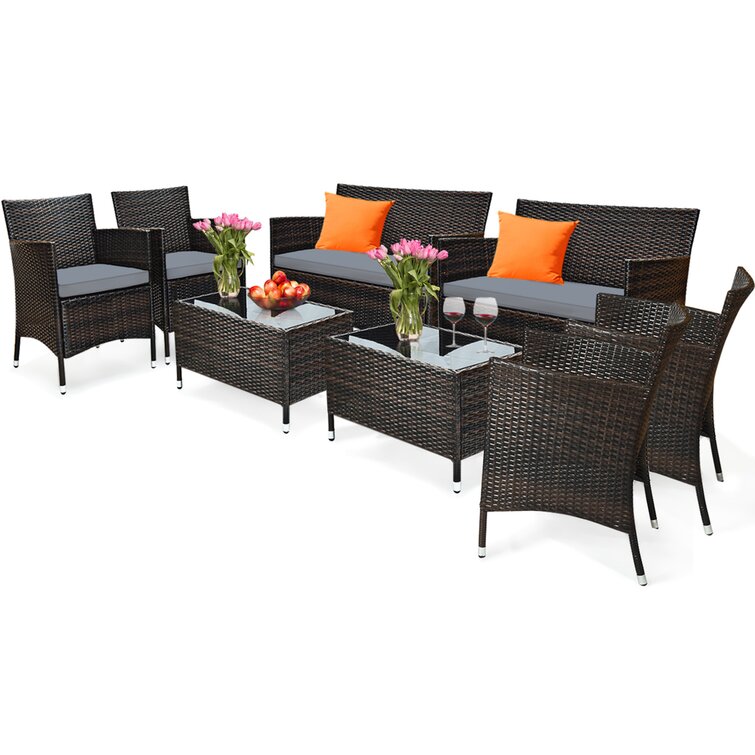 Latitude Run Satrogan 8 Piece Rattan Seating Group with Cushions